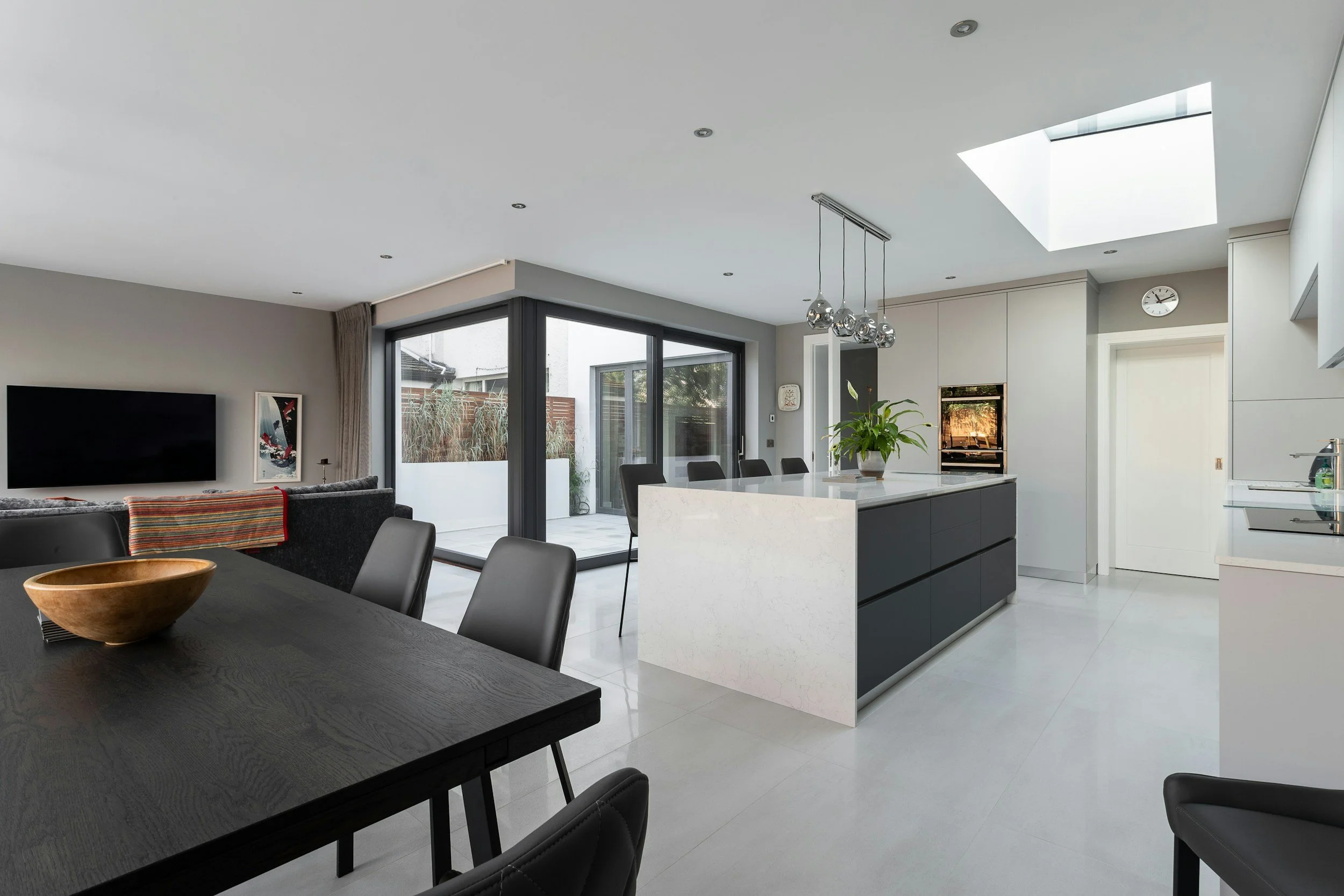 Open-plan whole-home remodel with skylight kitchen