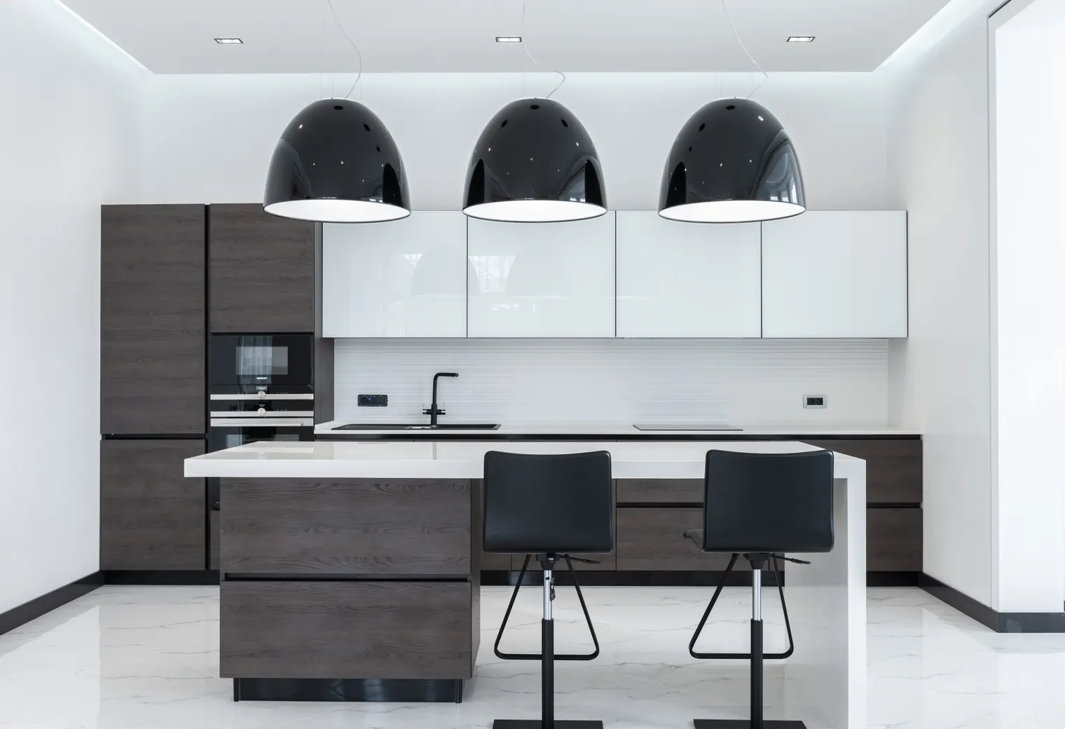 Planned remodeled kitchen with island and pendant lights